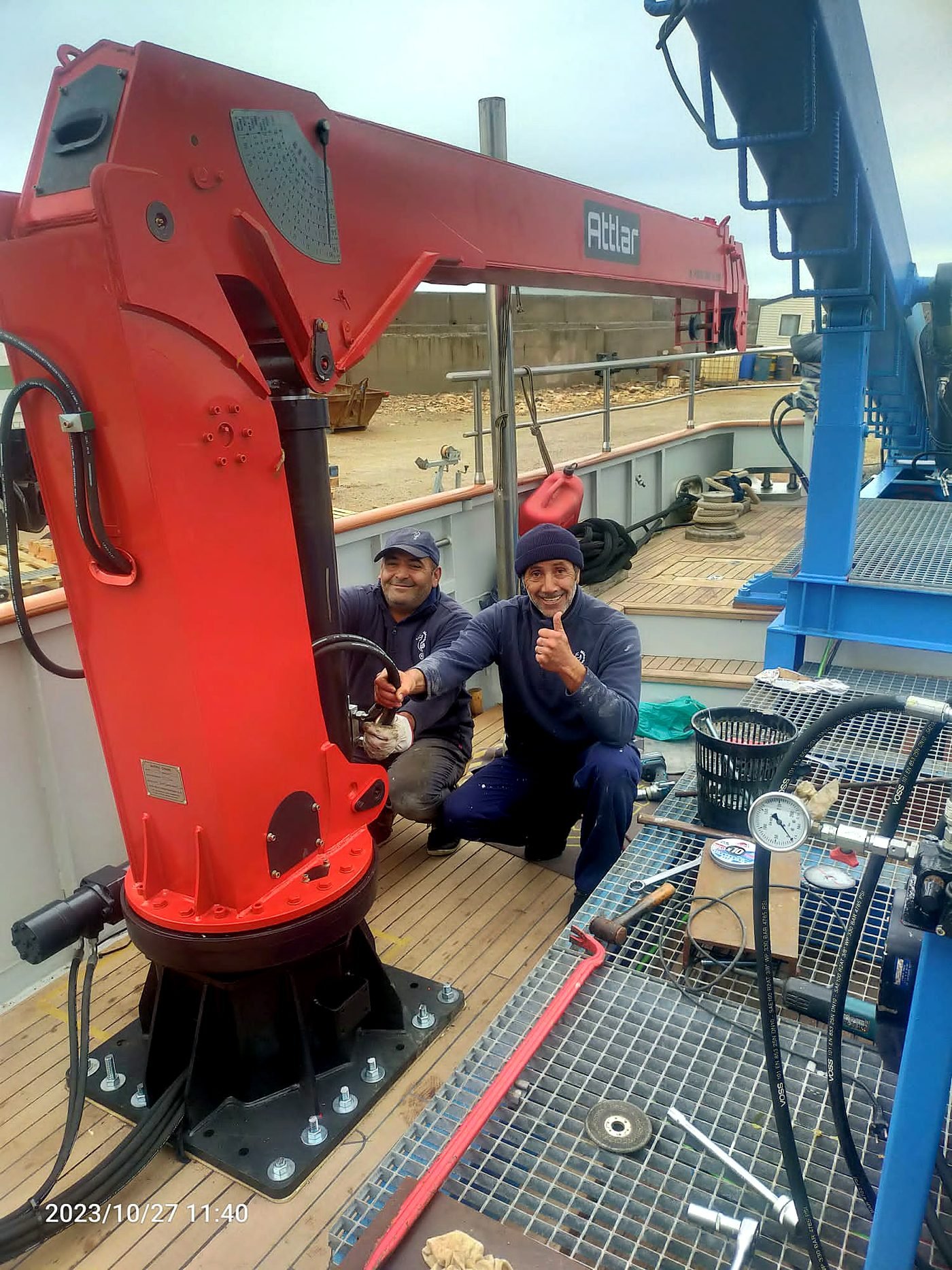 GPS lattice crane on a barge over water